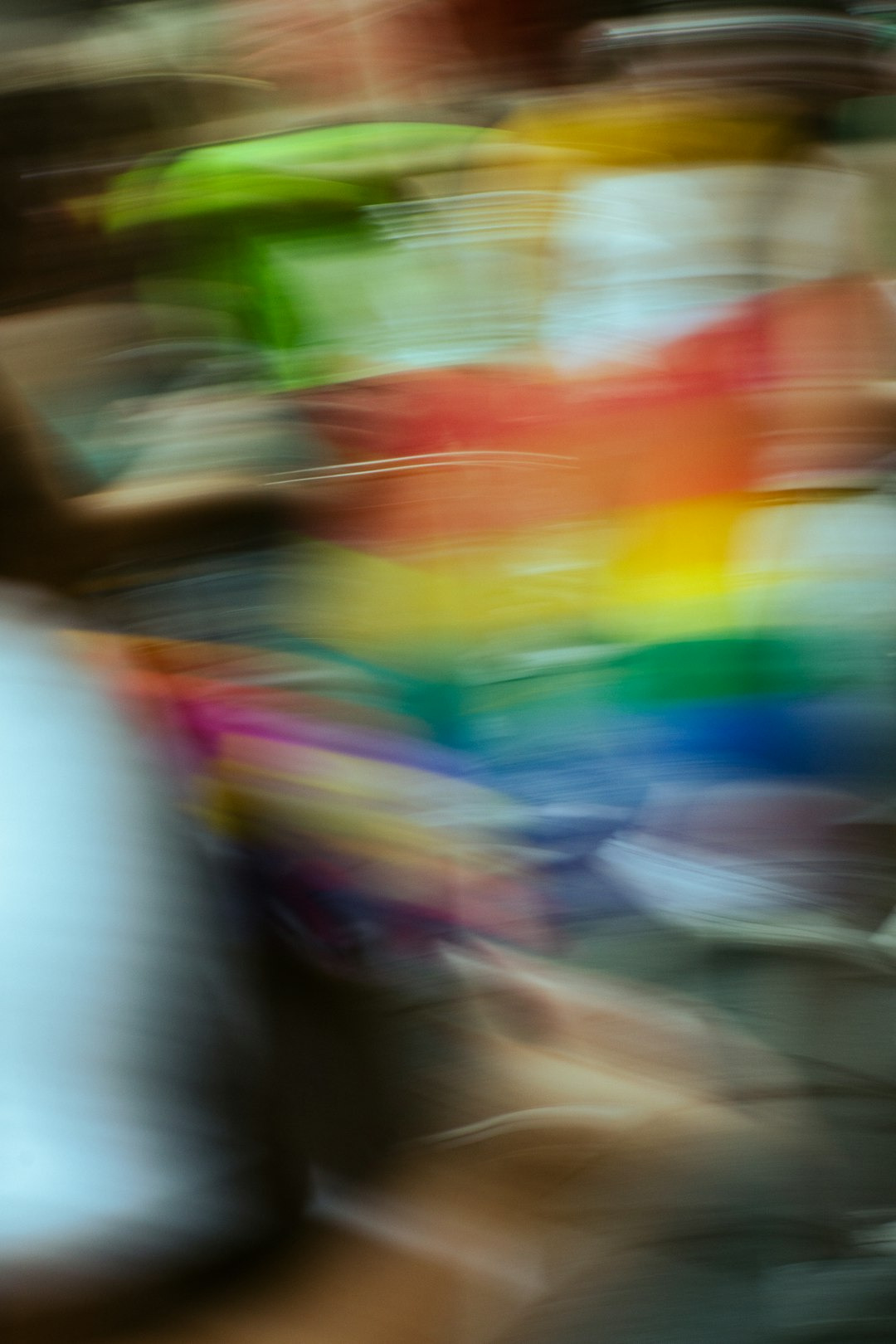 Abstract streaks of red orange yellow green and blue light.